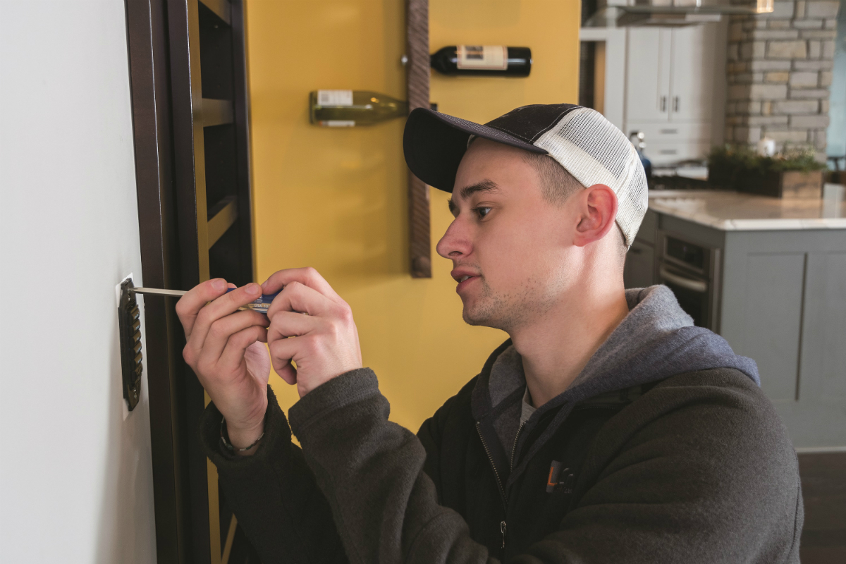 A Lelch worker installs new equipment  