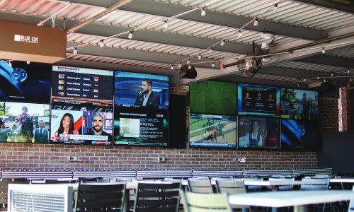 Interior of a restaurant AV setup highlighting a typical resimercial project.