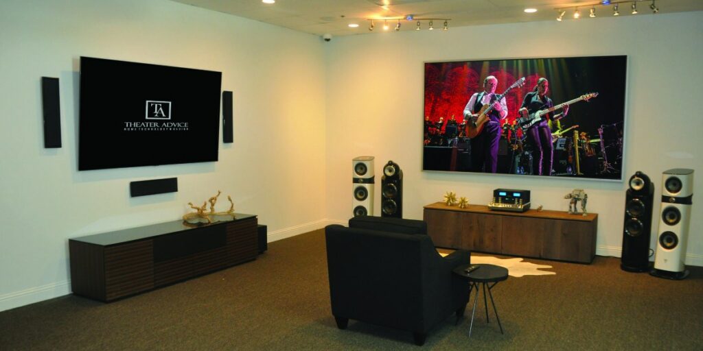 Two separate AV setups featuring twin mounted wall TVs, soundbars, and floorstanding speakers.