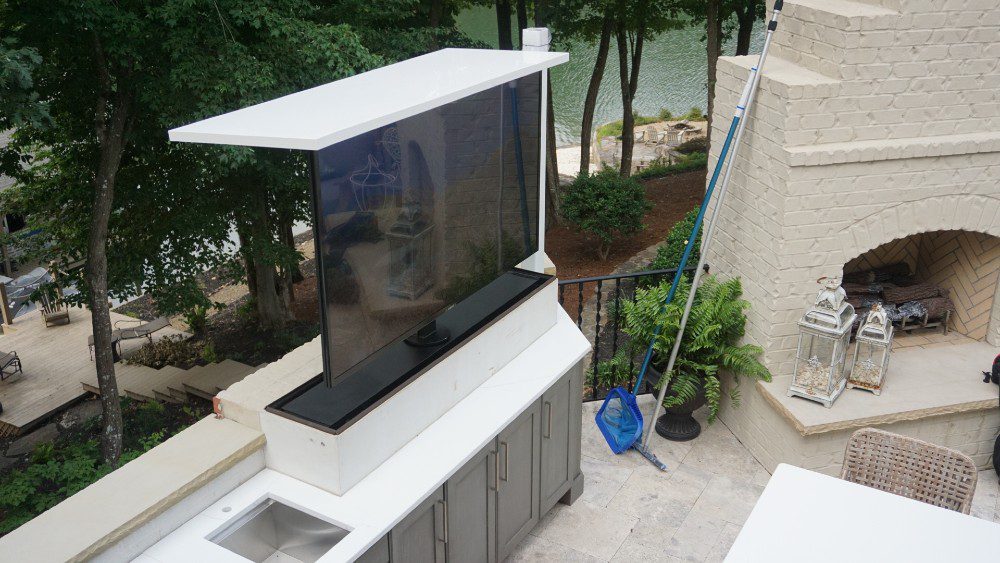 Auton concealed television lift at impressive outdoor entertainment area.