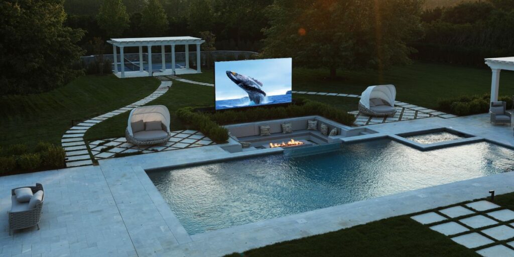 Expansive outdoor entertainment are poolside in Hamptons.