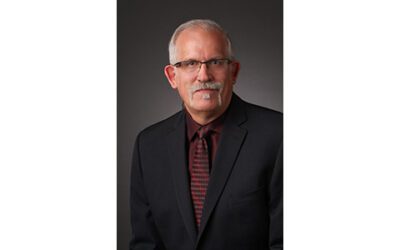 AES Names Bruce Olson President