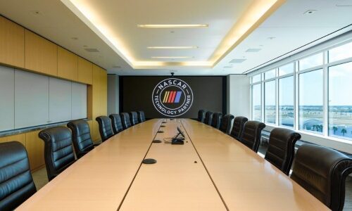 Interior of NASCAR HQ boardroom featuring Planar Video Walls at the back end.