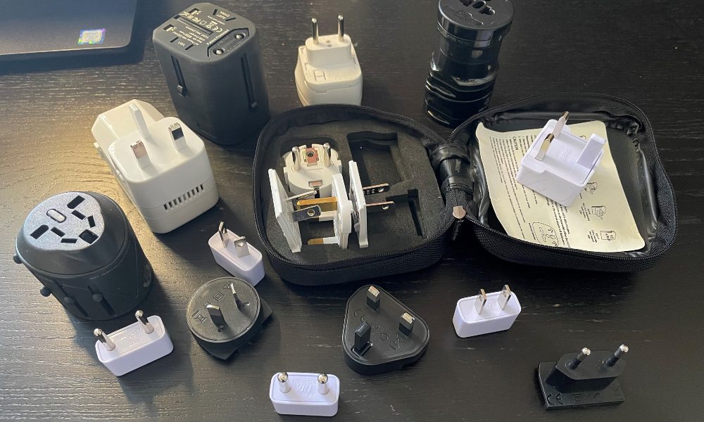 An assortment of electrical adaptors for the different voltages overseas.