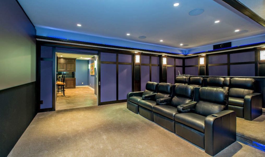 Completed home theater renovation, bar lounge in background. Automation Design + Entertainment