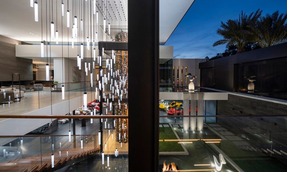 Exterior courtyard, modern lighting, car showroom.