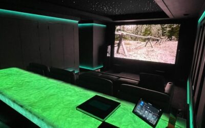 This Mammoth Theater Room Features a Color-Tunable, Luminescent Bar