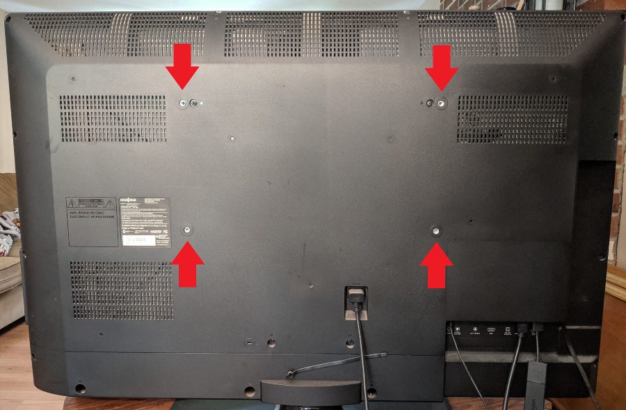 VESA mount screw holes on the back of a flat-screen TV