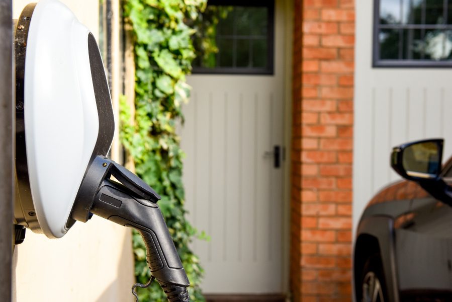 Electric car charger in front of home.