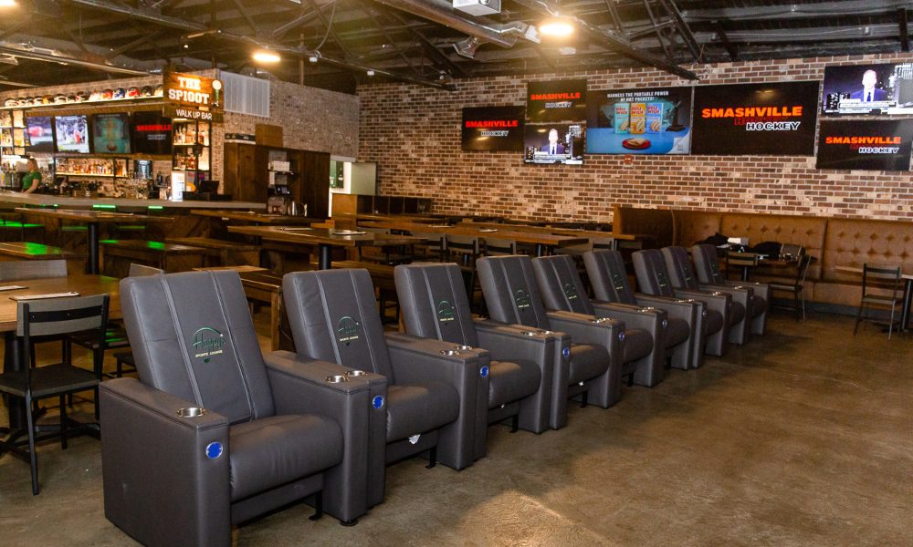 Home theater stadium seating in American Sports Bar Aesthetic at Happy's Sports Lounge