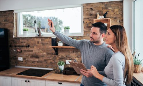 Man discussing with woman about home improvement spending.