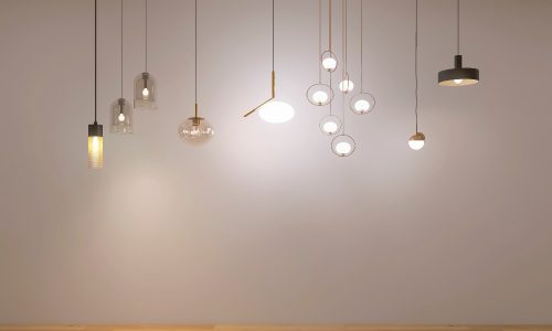 Lighting fixtures lined up in a row for a buying guide.