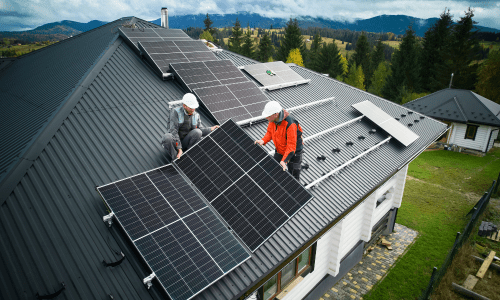 Image of contractors applying solar panels to residential home meant to represent resources made available under the National Climate Resilience Framework.