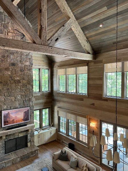 Interior, large lodge-like building with high chalet-style framing in living area alternative shot from loft Killen, Alabama