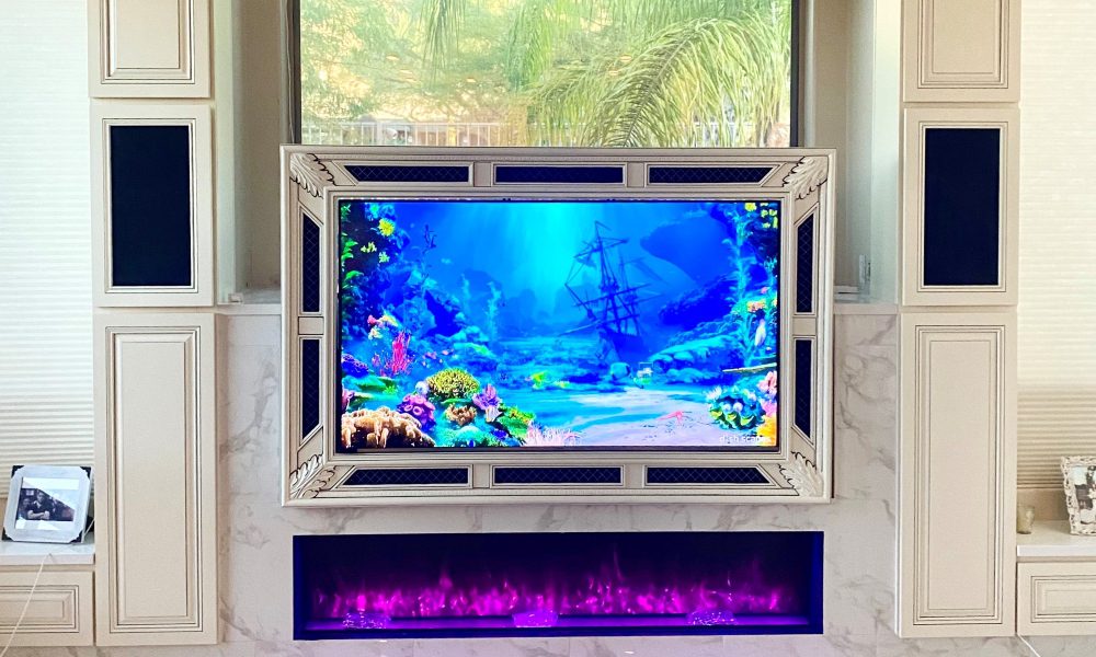 Miniature home theater system design set over fireplace in family room.