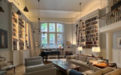 Historic 1900s NYC Apartment Hides a Television in its Bookshelf Cabinetry