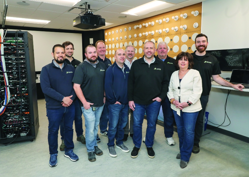 Barrett's Technology Solutions team including Brian Perreault standing in front of showroom
