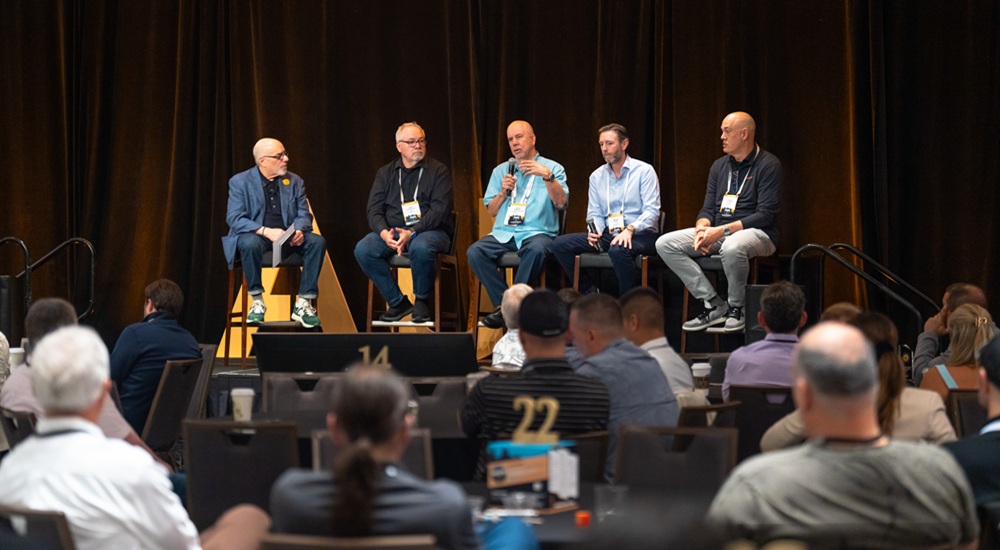 CEDIA's Mitch Klein (left) moderates a panel discussion on tariffs and their impact on the custom integration industry.