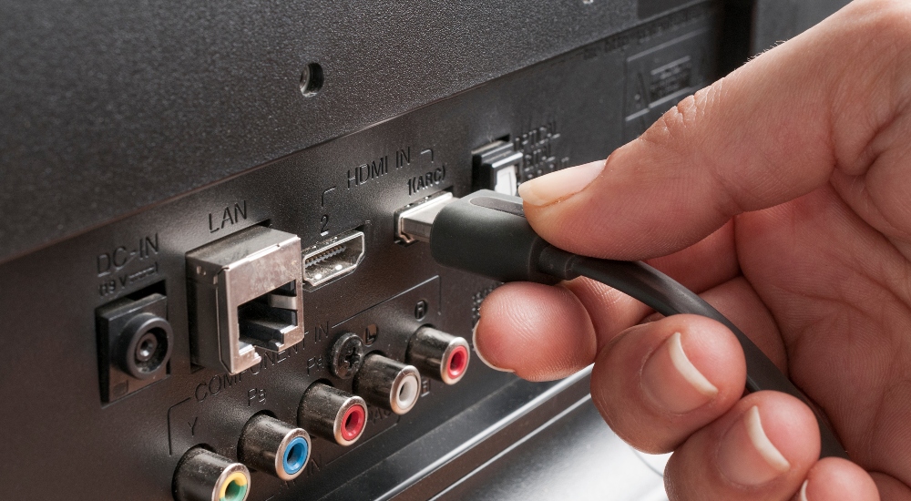 HDMI cable being plugged into TV to demonstrate HDMI 2.2 specification and Ultra 96 offerings