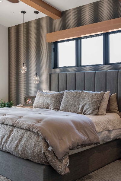 Plush bedroom setting in Colorado home with neutral color tones