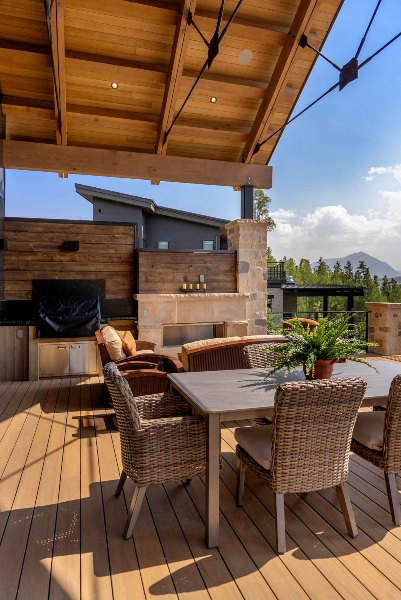 Outdoor living area and dining space showcased exposed architectural and design elements