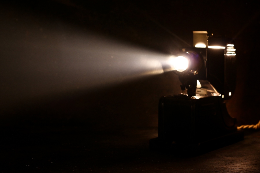 Old theater projector in shadows