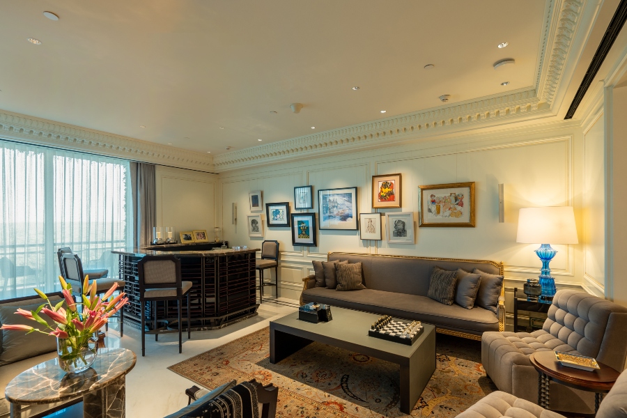 Refined seating area with a built-in dry bar, designed for casual entertainment within a fully automated living space.