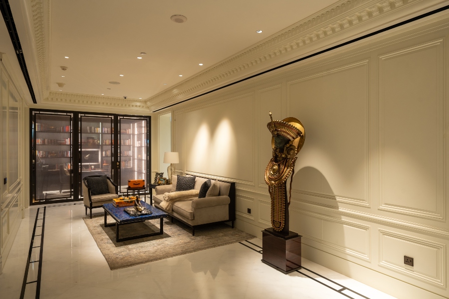 Cozy reading room combining traditional decor with smart lighting and climate automation.