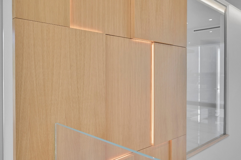 Subtle recessed wall lighting adds ambient illumination and architectural depth to this luxury home interior.