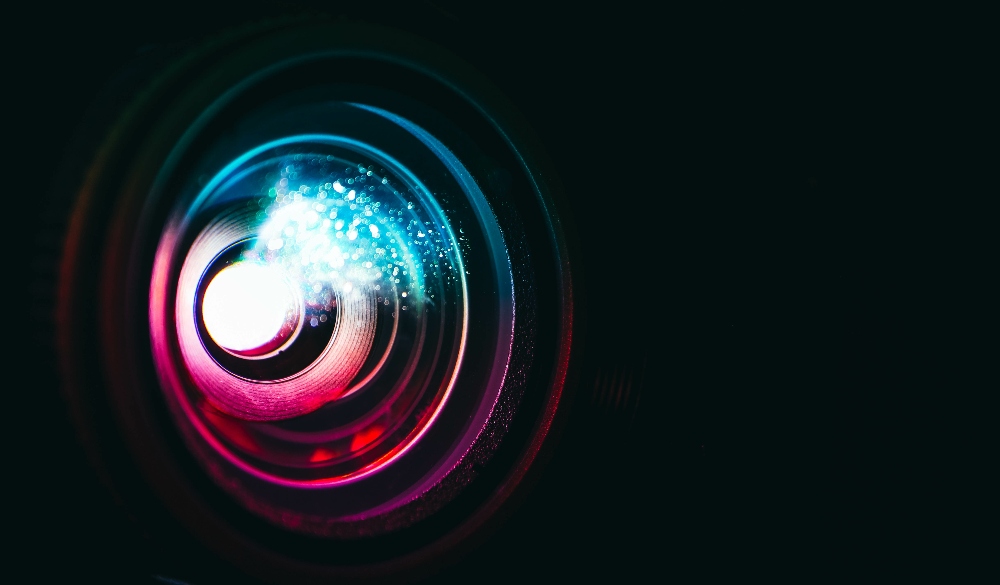 Closeup of projector lens for guide on how to properly set up a home theater projector