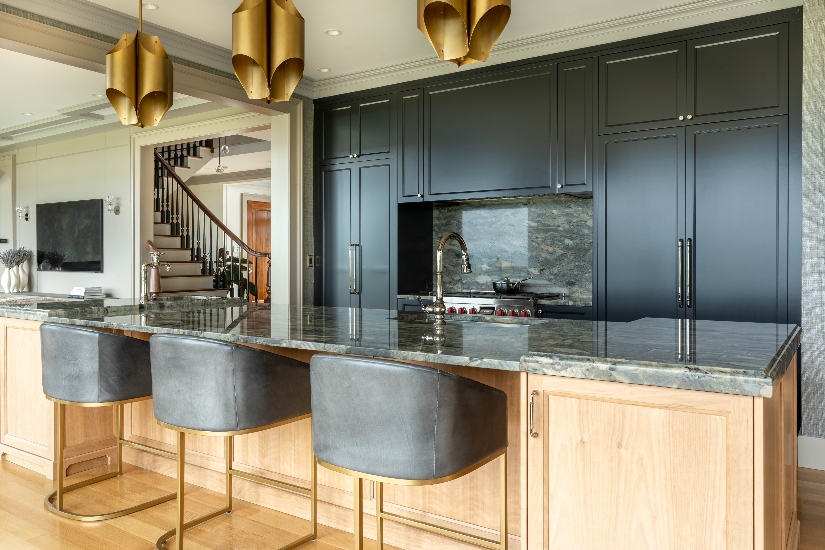 Hanging brass overhead fixtures in open bar kitchen with coastal decor