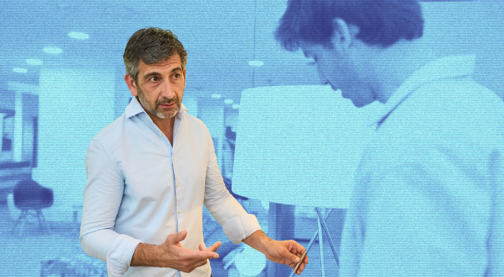 Man talking to potential client about lighting to symbolize a potential pitfall when using too many technical terms as part of the sales process or design pitch