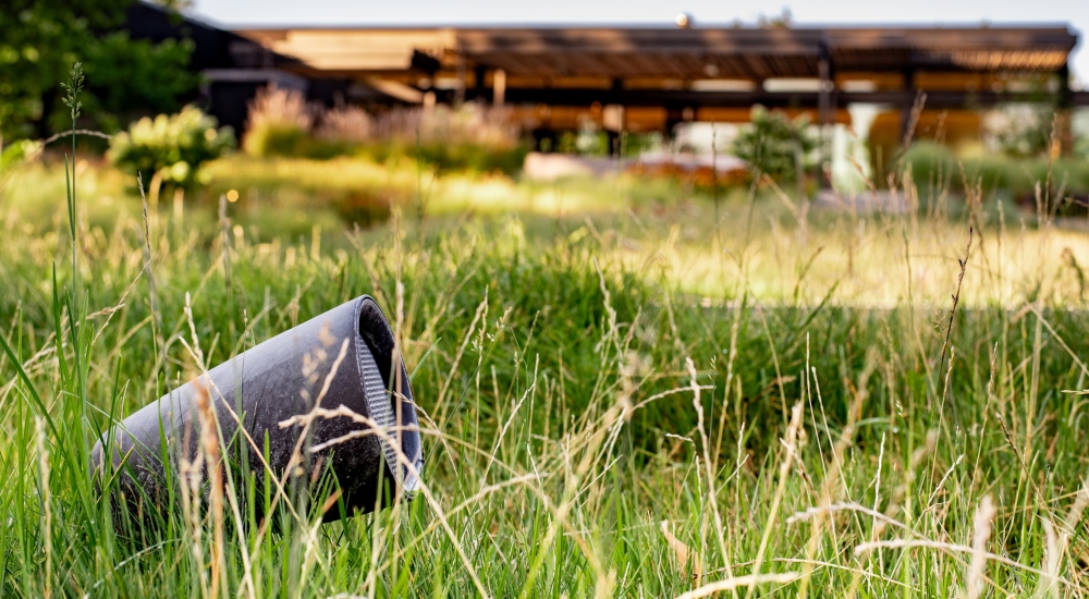 Outdoor bollard speakers integrated into Japanese-inspired landscape for smart home audio distribution