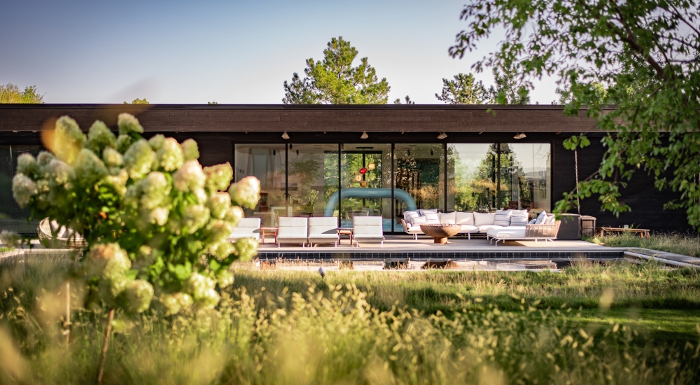 Side view of minimalist Japanese-inspired smart home architecture in Colorado with integrated technology