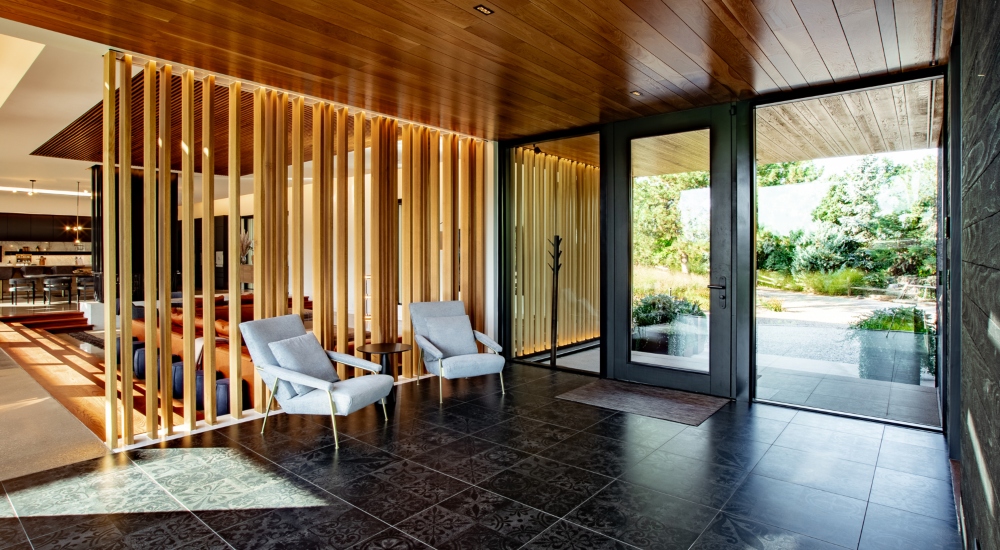 Foyer of Japanese-inspired luxury smart home blending minimalist design with smart lighting control
