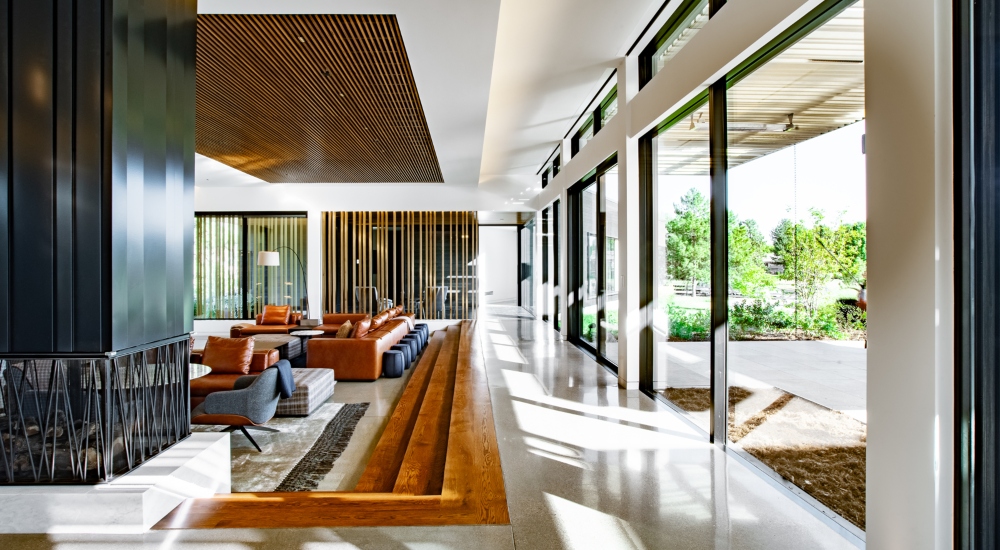 Living room of Colorado smart home featuring Control4 lighting, discreet audio, and minimalist interiors