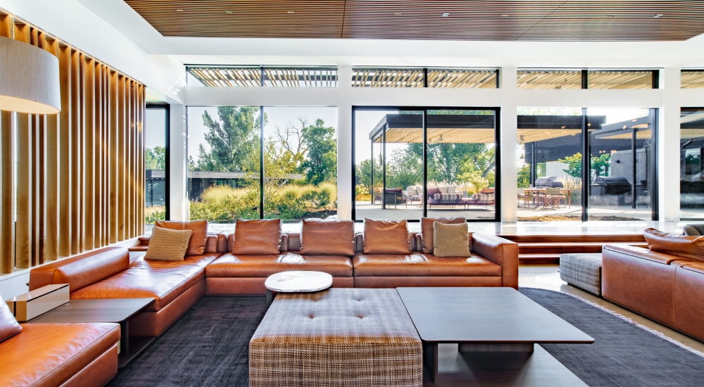 Living room of Colorado smart home featuring Control4 lighting, discreet audio, and minimalist interiors