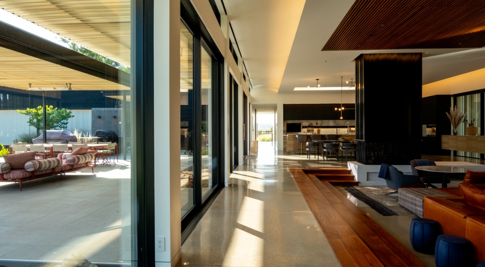 Living room of Colorado smart home featuring Control4 lighting, discreet audio, and minimalist interiors