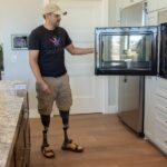 U.S. Army Staff Sergeant (Ret.) Dennet Oregon in his custom smart home made by Gary Sinise Foundation's R.I.S.E. program and Modern Image Pro Audio Inc.