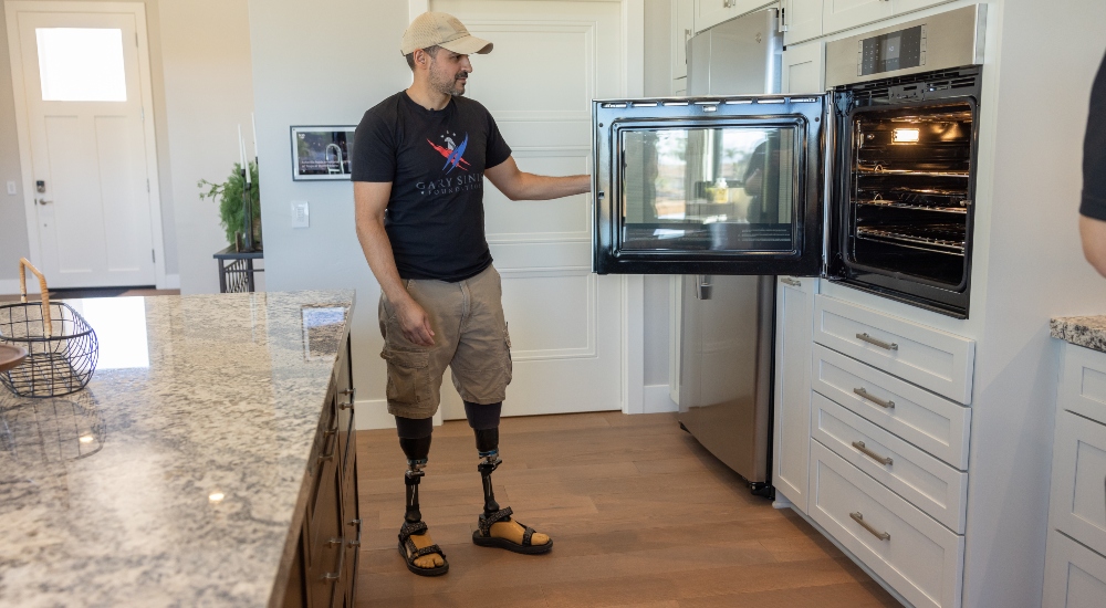 U.S. Army Staff Sergeant (Ret.) Dennet Oregon in his custom smart home made by Gary Sinise Foundation's R.I.S.E. program and Modern Image Pro Audio Inc.