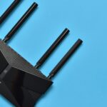 TP-Link router on blue background highlighting story being focused on in CE Pro's weekly Playback news recap of custom integration smart home AV stories
