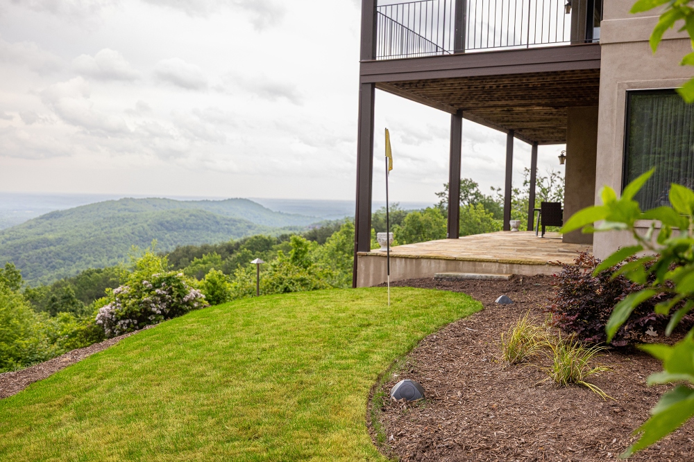 Backyard deck and garden area with immersive sound and lighting in a mountain getaway