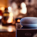 Smart speaker in living room meant to represent smart home adoption rates outlined in Vivint's How We Home report