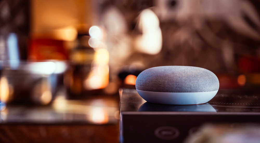 Smart speaker in living room meant to represent smart home adoption rates outlined in Vivint's How We Home report