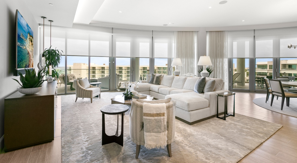 Luxury St. Regis Longboat Key penthouse living room with motorized Lutron dual shades and Gulf waterfront views