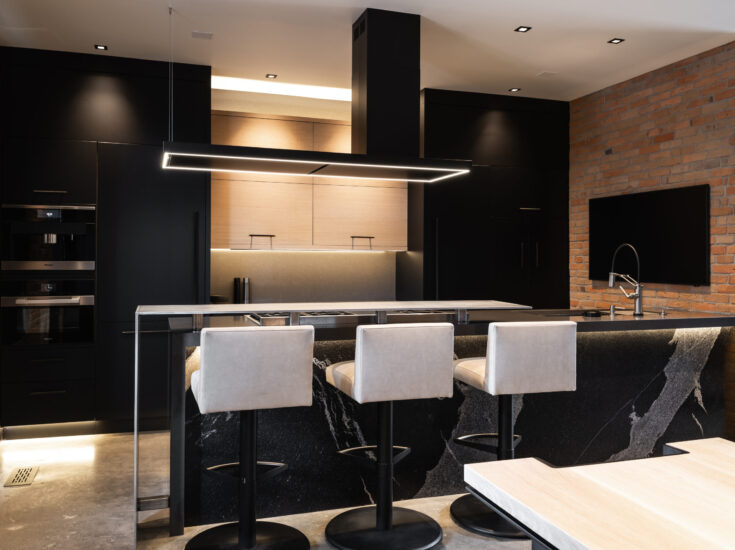 Restored historic kitchen with integrated smart home systems and seamless blend of old architecture and modern functionality