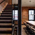 Original staircase in historic Gothic I-House with preserved architecture and integrated smart home lighting control