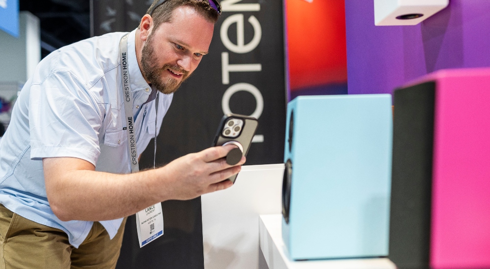 Man at CEDIA Expo 2025, meant to represent the opening of registration for the 2026 show