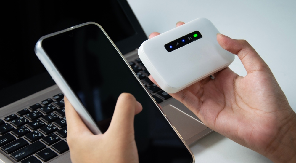 Average American consumer connecting to the internet through a Wi-Fi hotspot networking device.