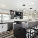 Custom kitchen with decorative pendant lights showcasing the intersection of design and technology